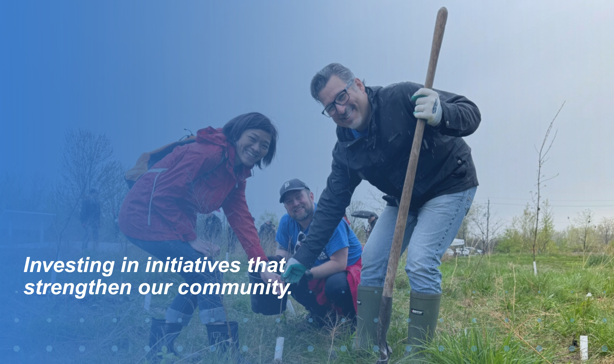 Volunteers participating in a community tree-planting initiative supported through ENWIN's Community Support Program.
