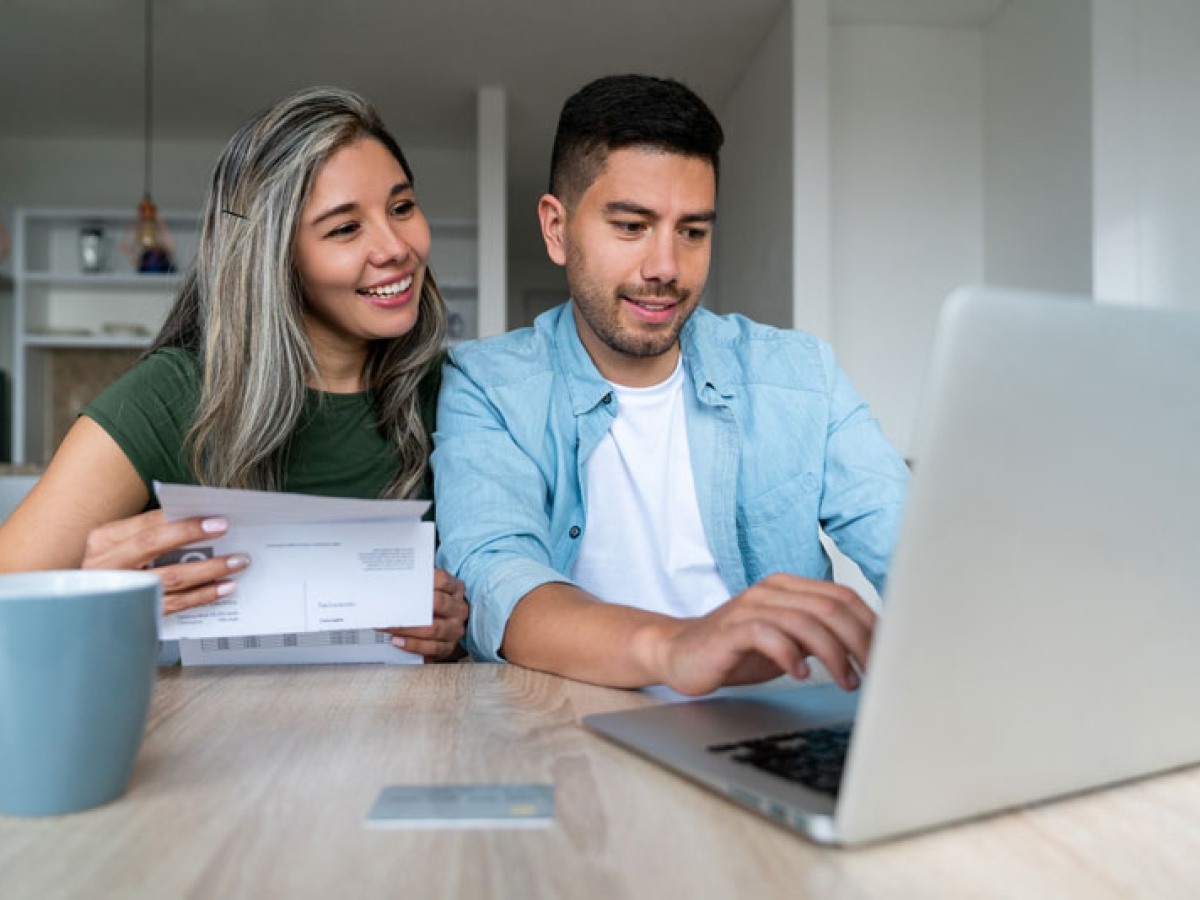 A young couple paying their bills
